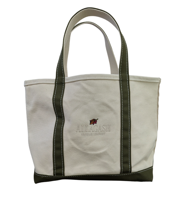 White tote bag with green accents. Leaf logo with white "Allagash Brewing Company" text