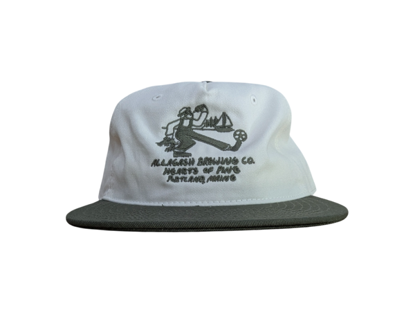 White cap with green brim, green logo featuring a Maine lobster and soccer theme. Green text reading "Allagash Brewing Co. Hearts of Pine Portland, Maine"