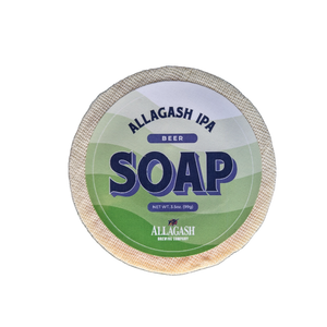 A round bar of soap with a green label