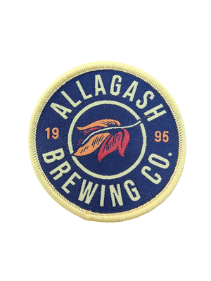 A round patch with the Allagash Brewing Co. logo, blue in color, with the text '1995' and 'ALLAGASH BREWING CO.'