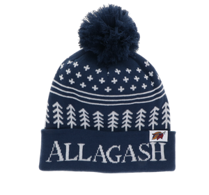 A blue and white winter hat with pom pom and White text reading ALLAGASH