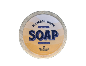 A round bar of soap with yellow label
