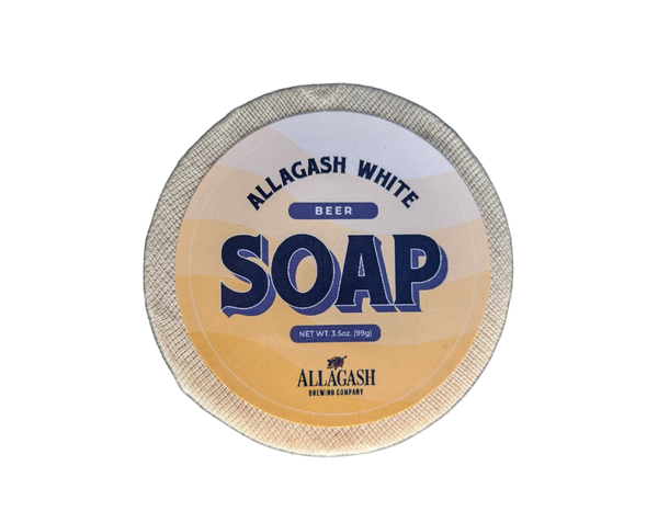A round bar of soap with yellow label