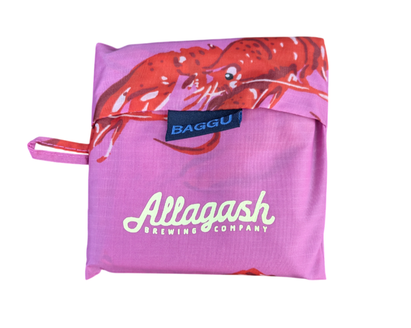 Pink reusable bag with lobster design and Allagash Brewing Company branding on a white background