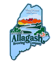 A magnet shaped like the state of Maine with a colorful design and the Allagash Brewing Company logo.