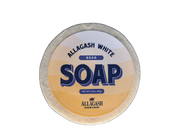 A round bar of soap with yellow label